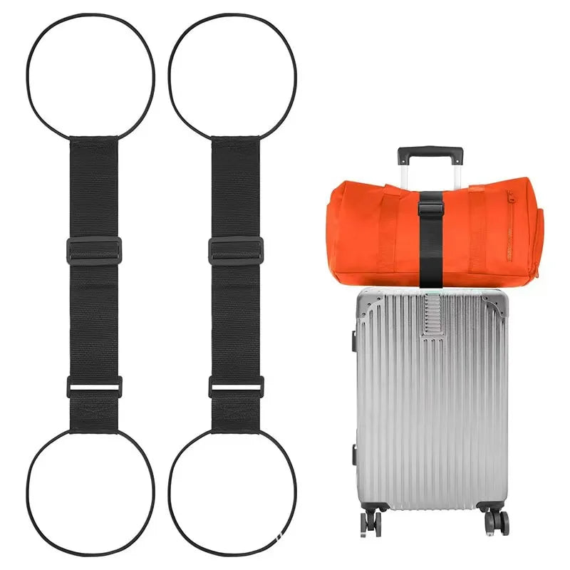 Un par de correas de equipaje negras ajustables con aberturas circulares junto a una bolsa de ruedas naranja.