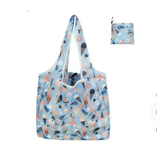 A light blue and orange patterned reusable fashion shopping tote bag with a drawstring closure.