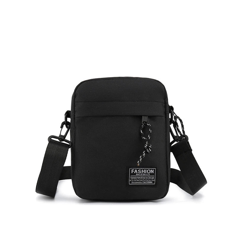 Black minimalist nylon crossbody bag for men with adjustable strap and chain detail