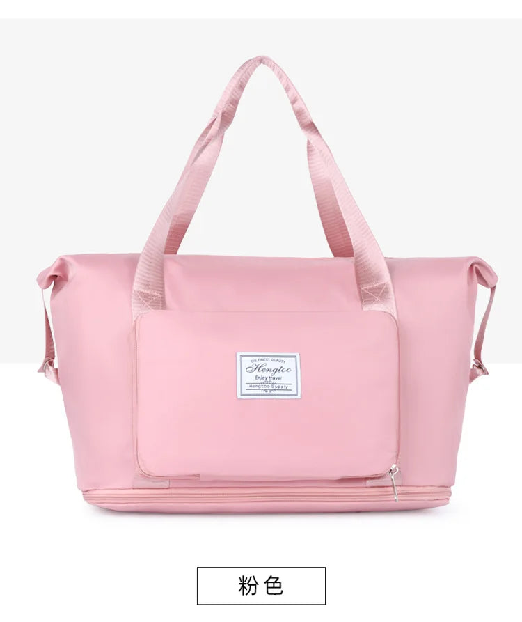 A pink expandable travel organizer bag with handles and a zippered compartment.