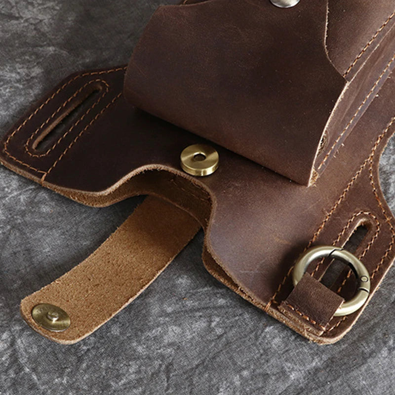 A brown genuine leather men's waist bag with brass hardware shown from above.