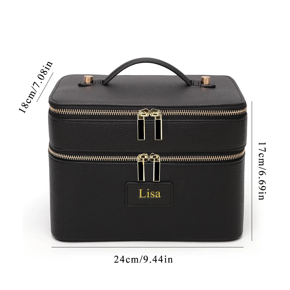 Black double-layer makeup storage case with gold zippers and a personalized name tag