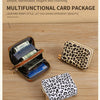 A leopard print multi-functional card package featuring a gold zipper and various cards and cash inside.