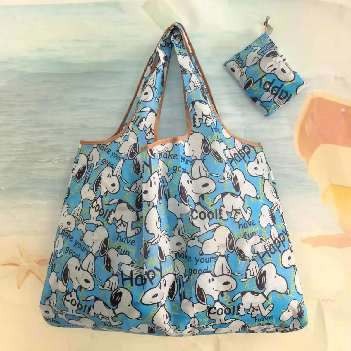 A light blue and white reusable shopping bag with a dog design, shown against a pale background.