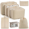 A set of beige mesh packing cubes and a matching drawstring bag for travel organization.