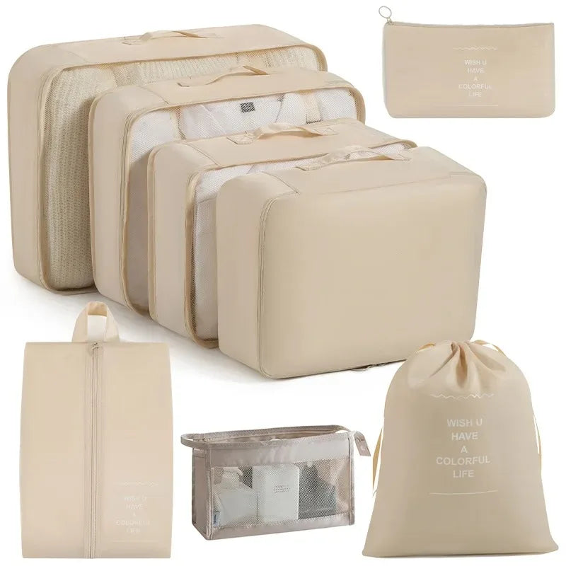 A set of beige mesh packing cubes and a matching drawstring bag for travel organization.