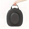 A hand is holding a black durable EVA hard shell hat case.