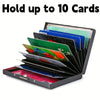 A black metal card holder displaying ten colorful cards, including floral designs.