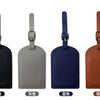Four luggage tags in black, gray, blue, and brown PU leather with metal attachments.