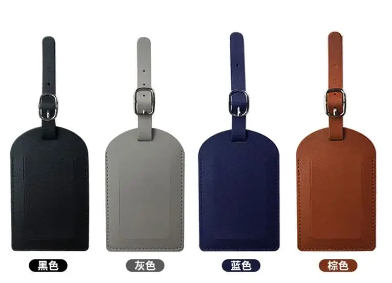 Four luggage tags in black, gray, blue, and brown PU leather with metal attachments.