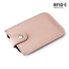 A light pink genuine leather slim card holder with a black lining and a gold-colored snap closure.