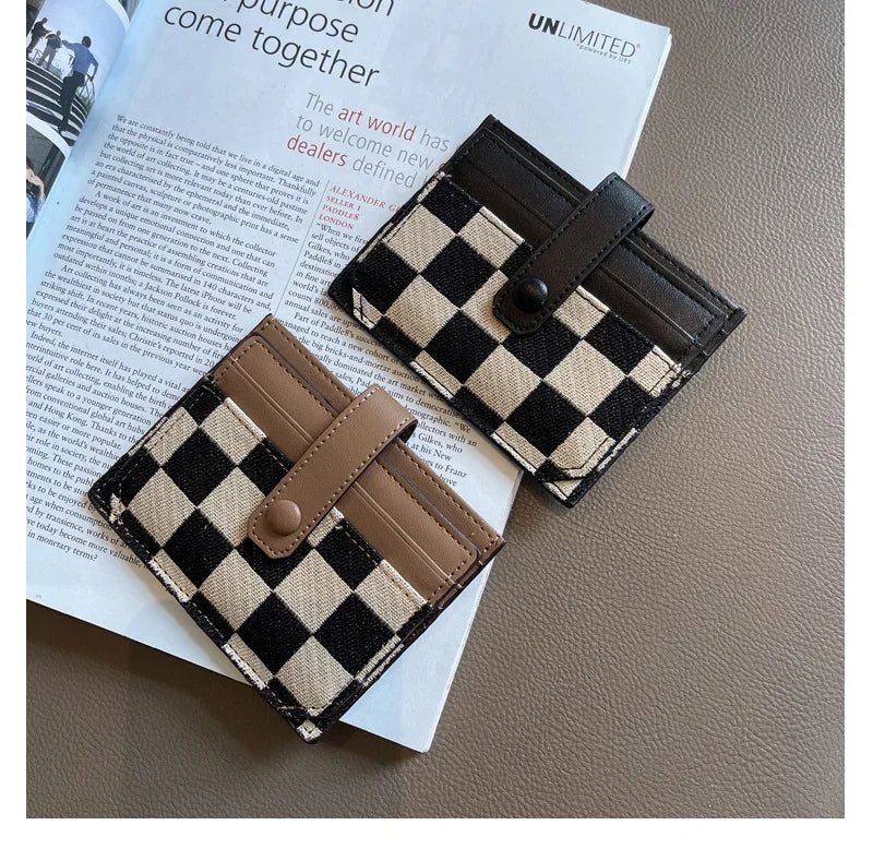 A black and beige checkered PU leather mini card wallet is shown open on a white paper background.