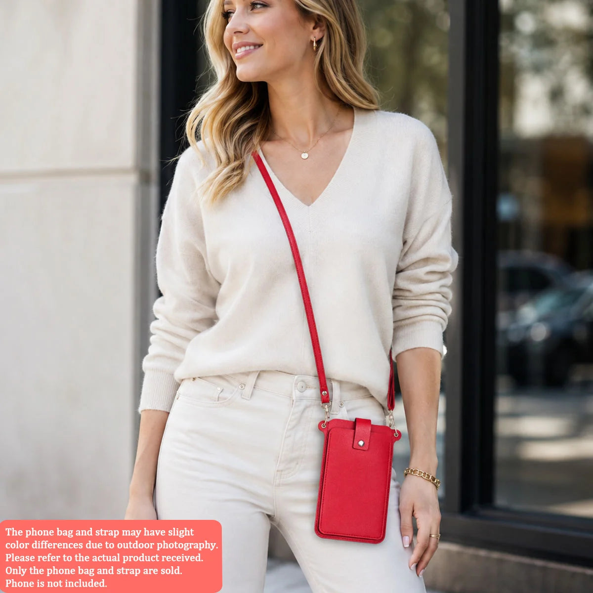 A woman models a red mini PU leather crossbody phone bag and strap with light wash jeans.