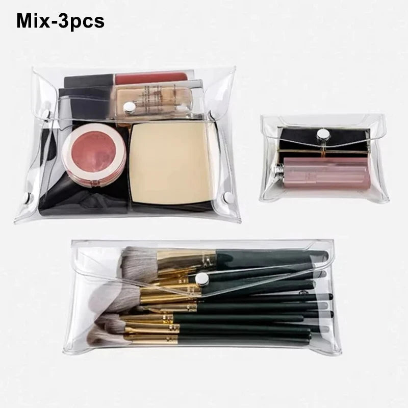 A set of three cosmetic or tool items packaged in transparent portable organizer pouches.