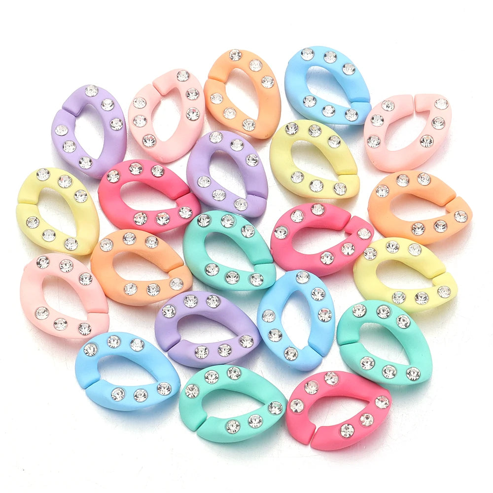 A collection of colorful acrylic link chains in various pastel shades like pink, purple, yellow, and blue.