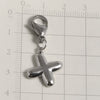 Silver stainless steel alphabet letter charm shaped like a cross with a lobster clasp