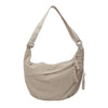 A beige canvas crossbody shoulder bag with a drawstring closure.