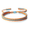 Handmade braided rope bracelet featuring colorful orange and blue threads.