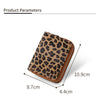 A brown leopard print PU leather compact wallet shown with its dimensions.