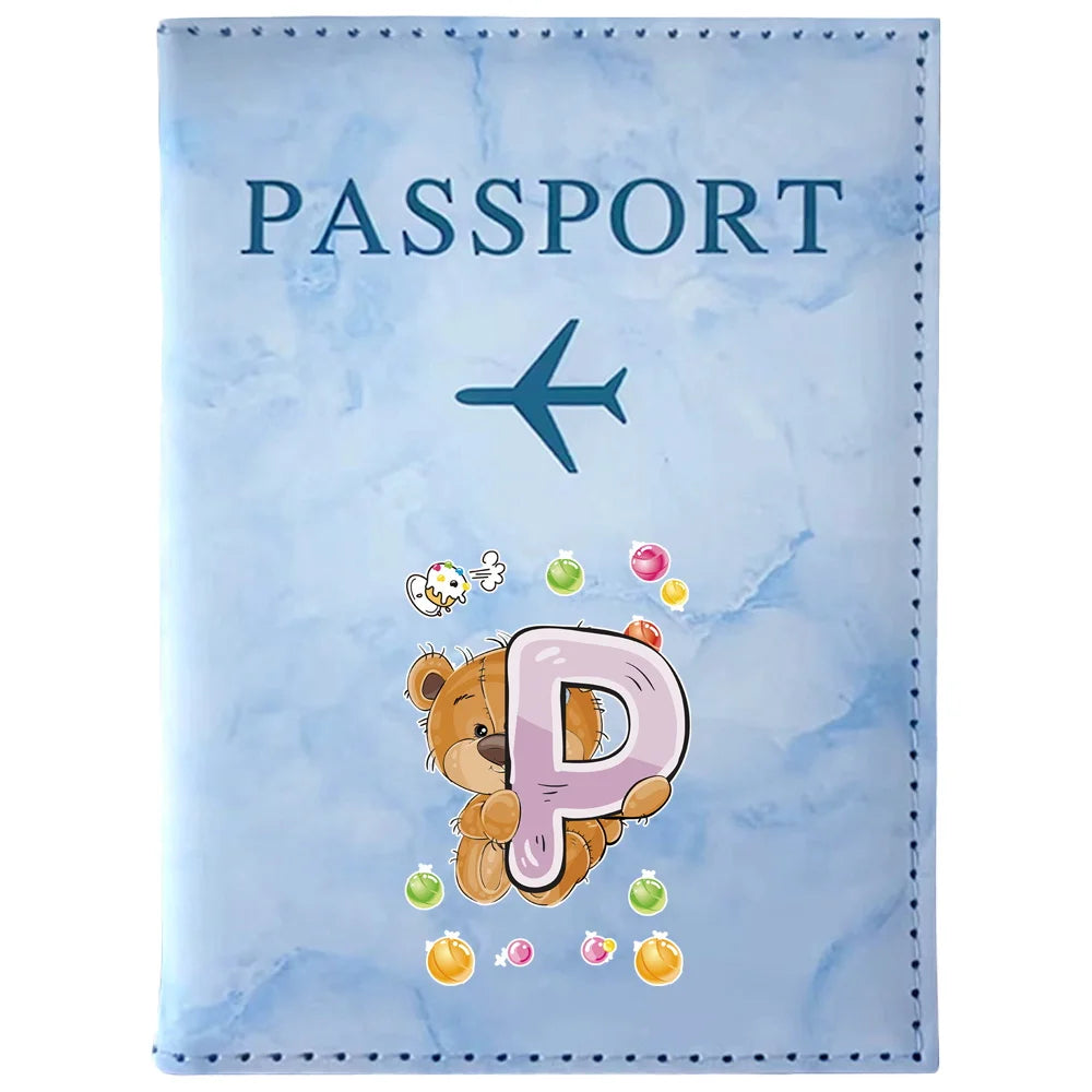 Light blue passport card holder featuring a stylized bear paw print and the letter P