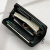 Black multi-card men's commuter wallet open showing various cards and a smartphone.