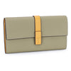 A light olive green genuine cow leather bifold wallet with a tan leather strap.