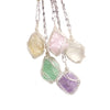 Handcrafted amethyst crystal pendant necklace featuring various colored crystals wrapped with copper wire.