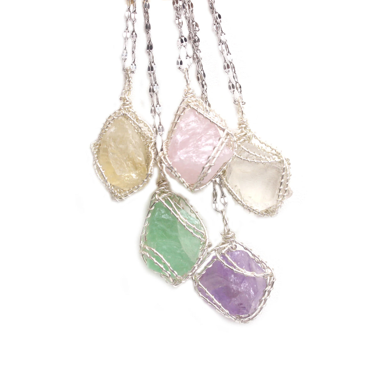 Handcrafted amethyst crystal pendant necklace featuring various colored crystals wrapped with copper wire.