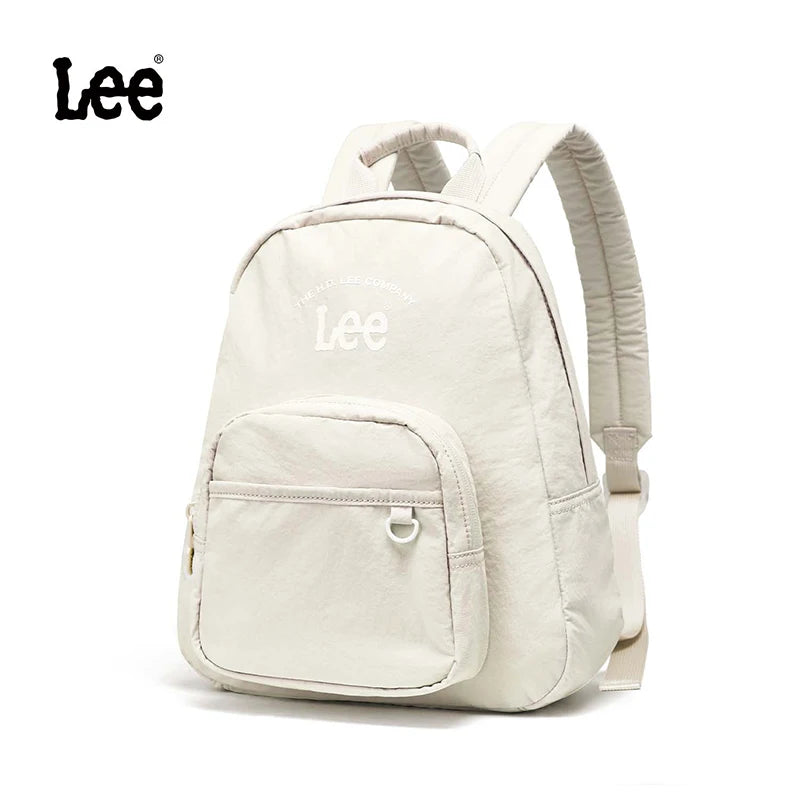 A cream-colored Lee lightweight waterproof daypack with a tablet compartment shown from the back.