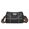 A black luxury cowhide shoulder bag with white stitching and a leather strap.