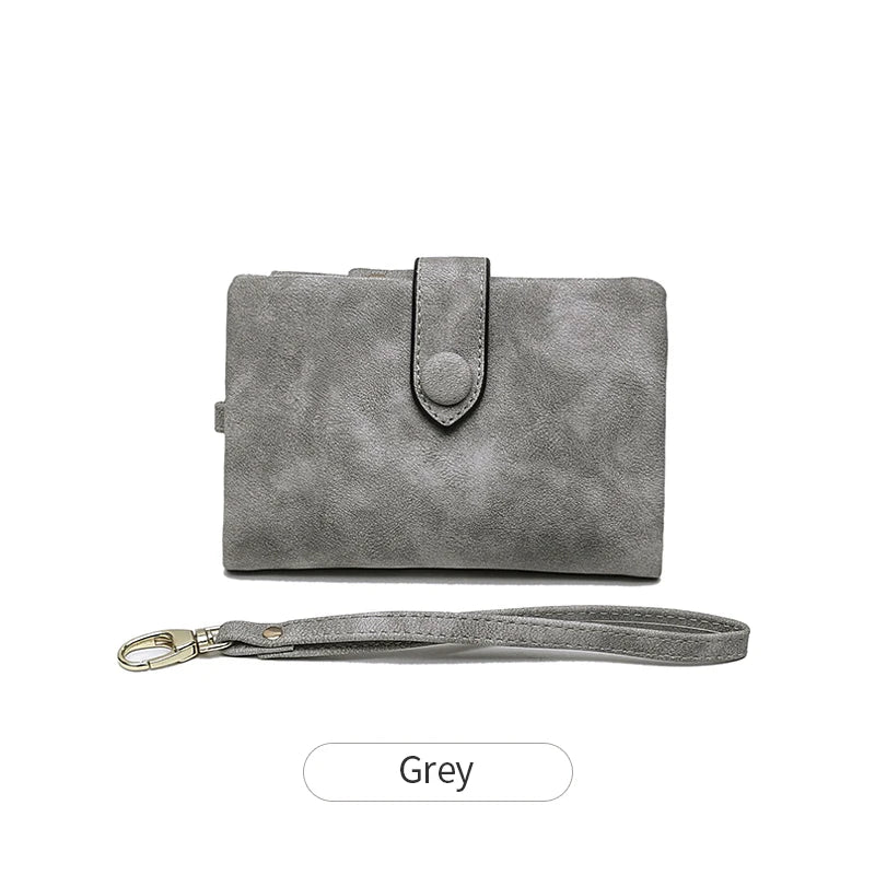 A grey women's multi-slot frosted card wallet with a leather strap.