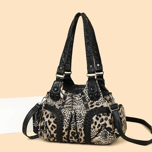 A black and beige leopard print PU leather tote bag with an adjustable strap.