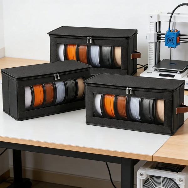 Black foldable filament storage racks with spools of filament are displayed on a white table.