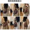 Close-up shots of a leopard print crossbody bag worn with a beige jacket.