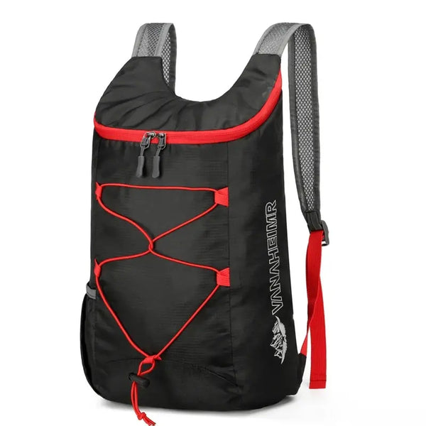 Black outdoor folding backpack with gray straps and red accents