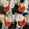 A person is holding an orange canvas crossbody bag against a white sweatshirt, shown in multiple angles.