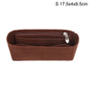 A brown felt bag insert organizer with a zipper closure and a small metal charm.