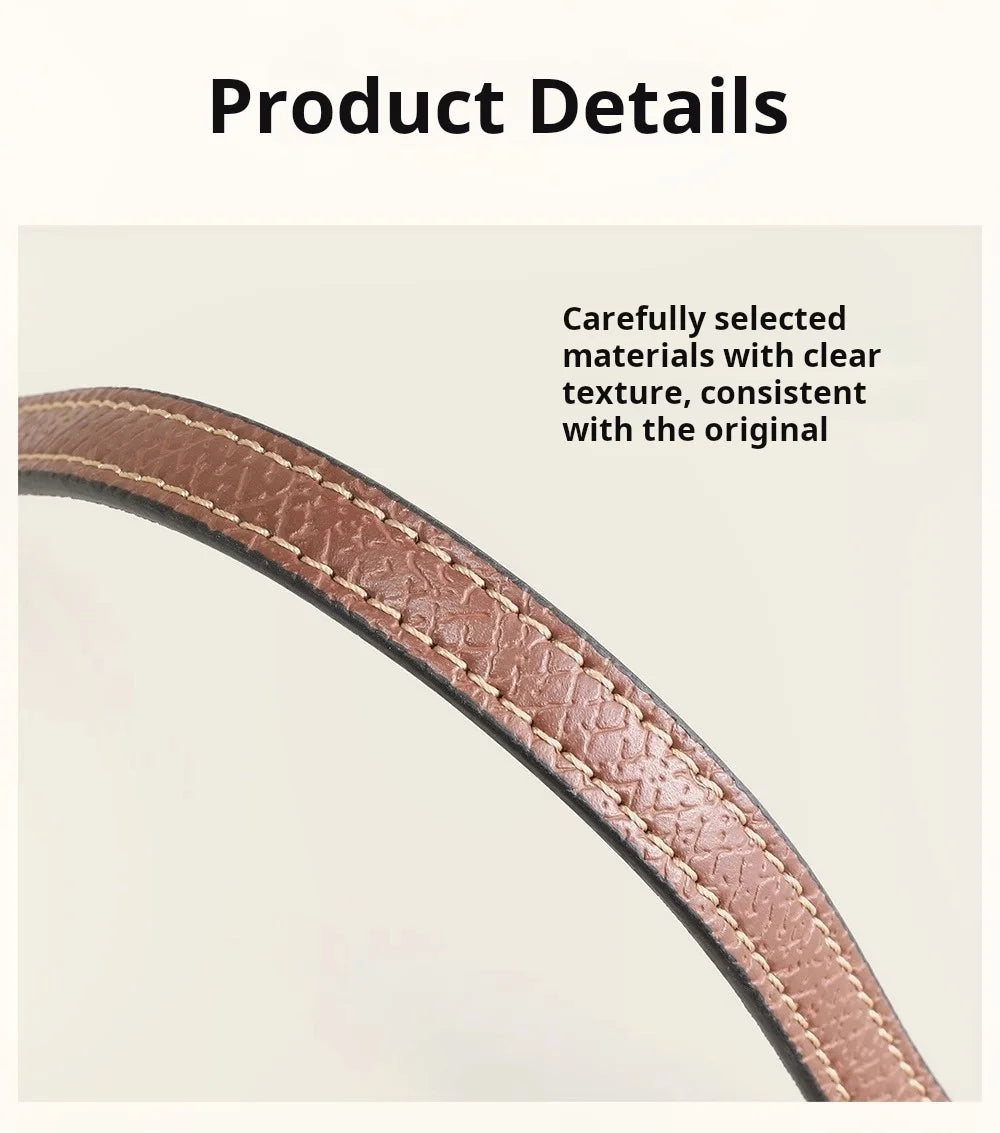 A close-up view of a brown leather crossbody strap showing its texture and stitching.