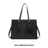 Black croc-embossed leather tote bag with long handles