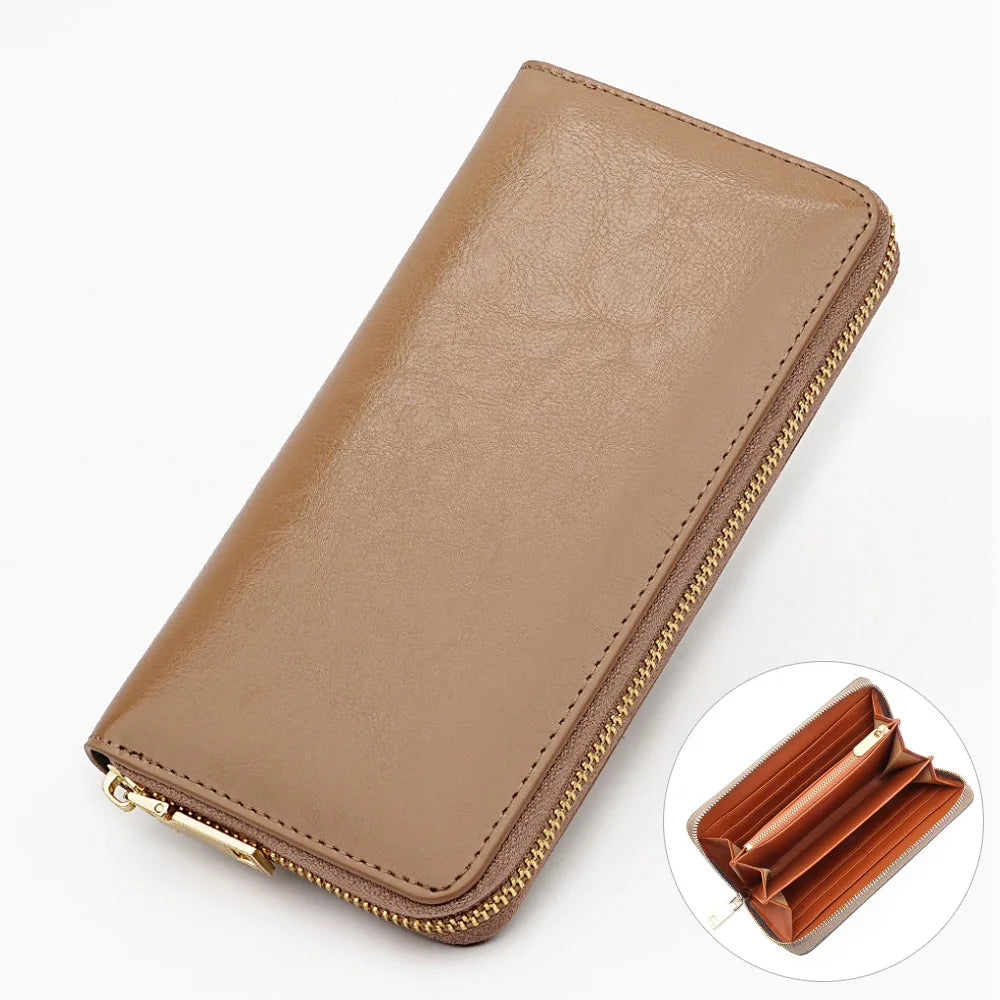 A tan genuine leather zipper wallet shown in a diagonal view with a close-up of the interior.