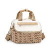 A beige quilted mommy bag with a light cream lining and tan strap is shown from the front.