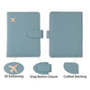 Light blue PU leather passport holder featuring 3D embossing, snap button closure, and crafted stitching.