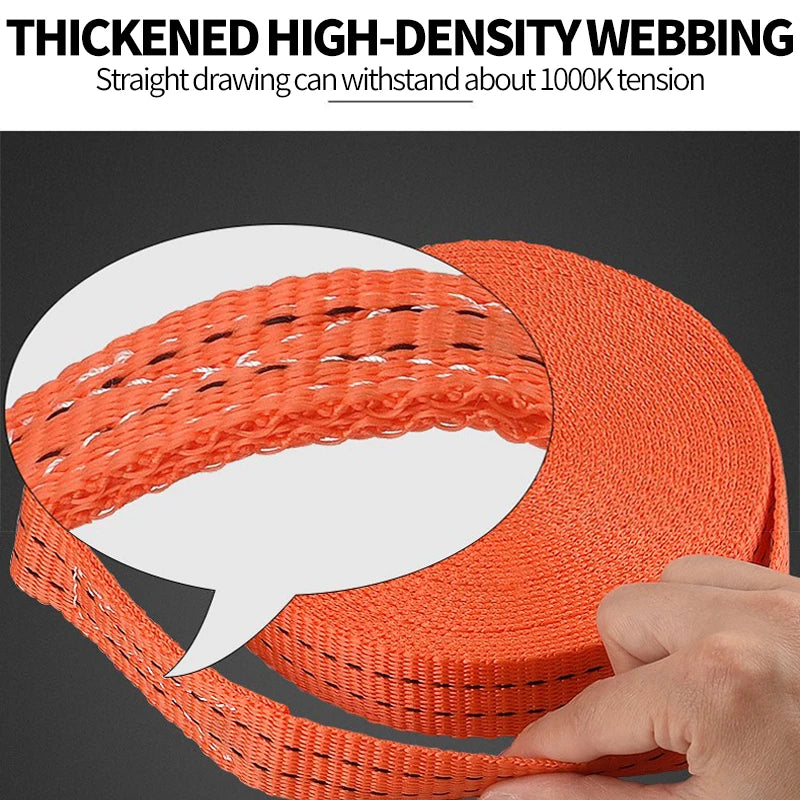 Close-up of thick orange webbing material demonstrating high tensile strength for vehicle securing straps.