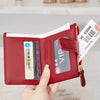 A red PU leather bifold wallet with a zipper, displaying an ID window and a VIP card.