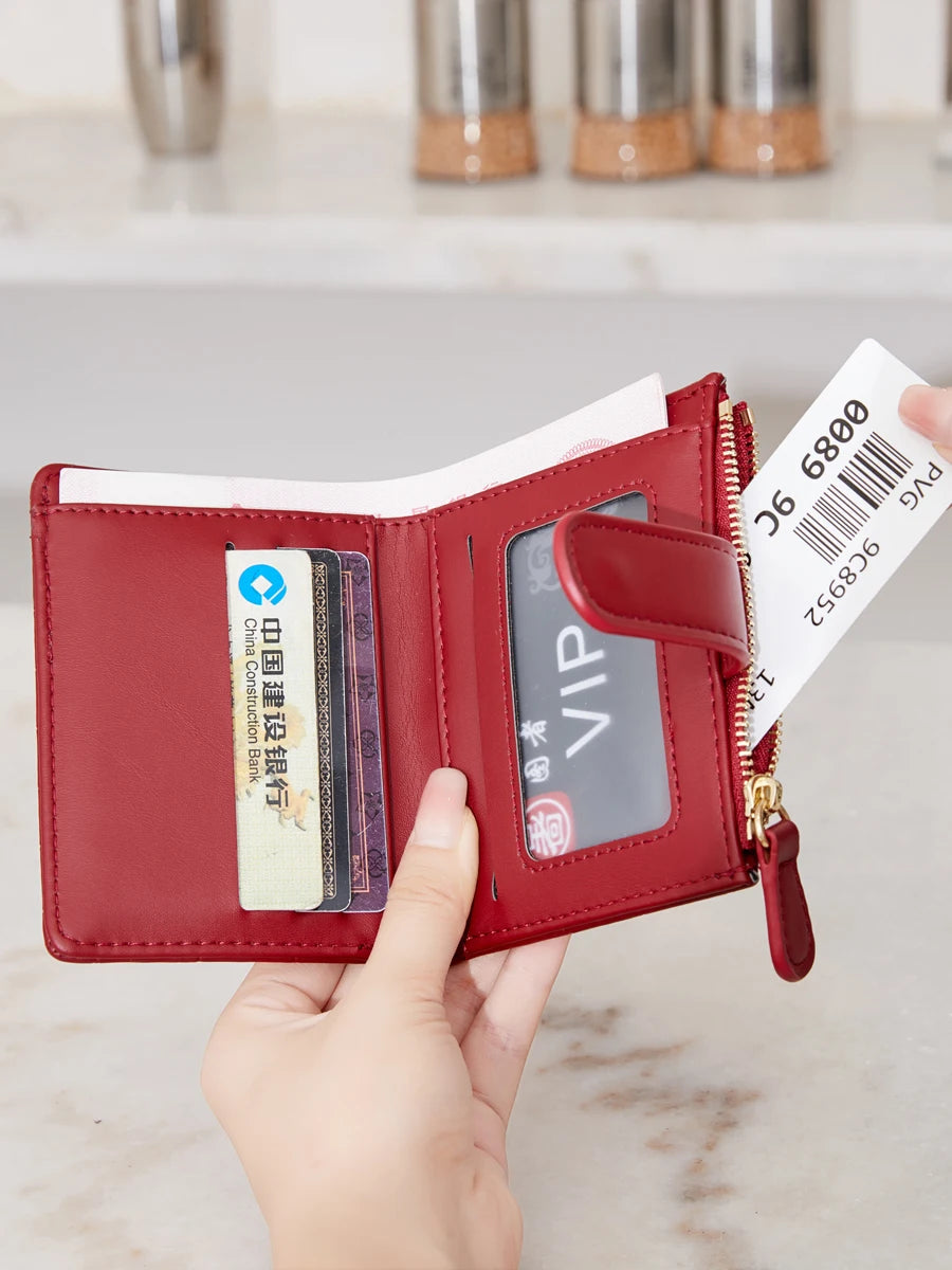 A red PU leather bifold wallet with a zipper, displaying an ID window and a VIP card.