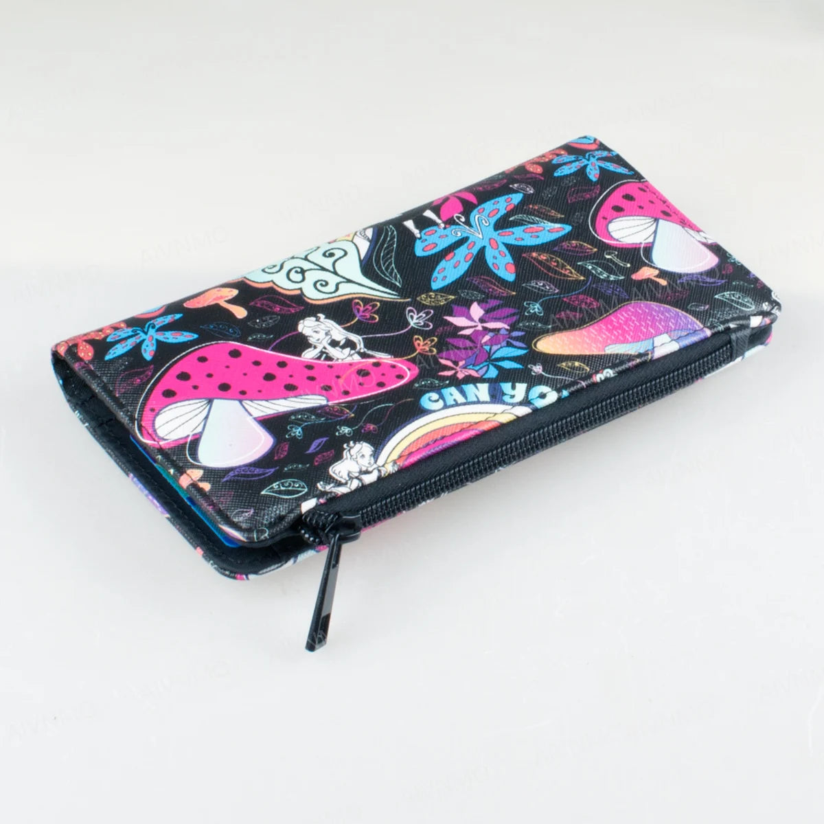 A black canvas wallet featuring a vibrant pattern of mushrooms and floral designs with a pink and purple accent.