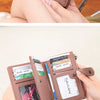A brown women's RFID blocking clutch wallet shown in various angles and being held by a hand.