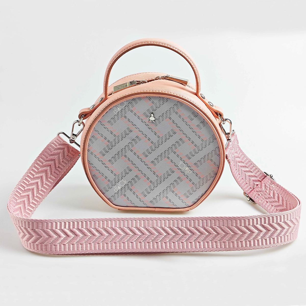 A light pink crossbody bag with a wide adjustable strap featuring an arrow jacquard pattern.