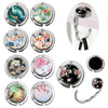 A collection of multi-pattern zinc alloy bag hooks featuring various floral and abstract designs.