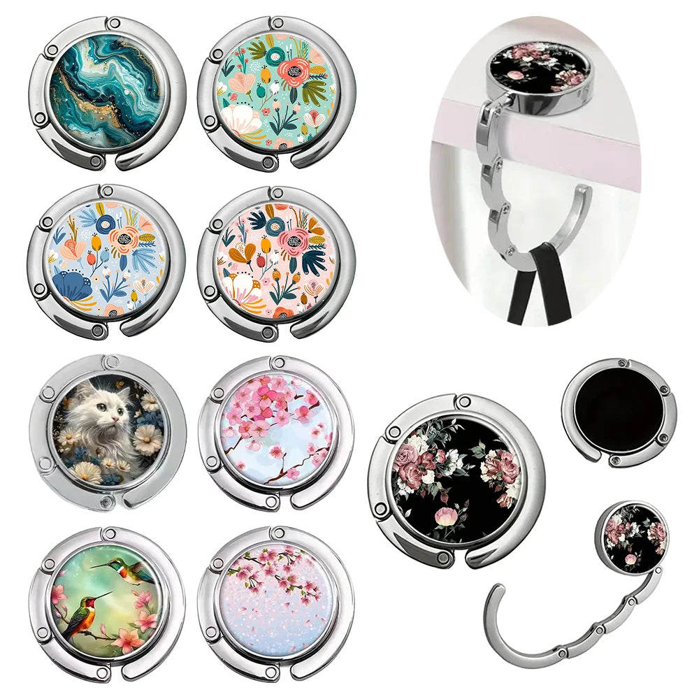 A collection of multi-pattern zinc alloy bag hooks featuring various floral and abstract designs.